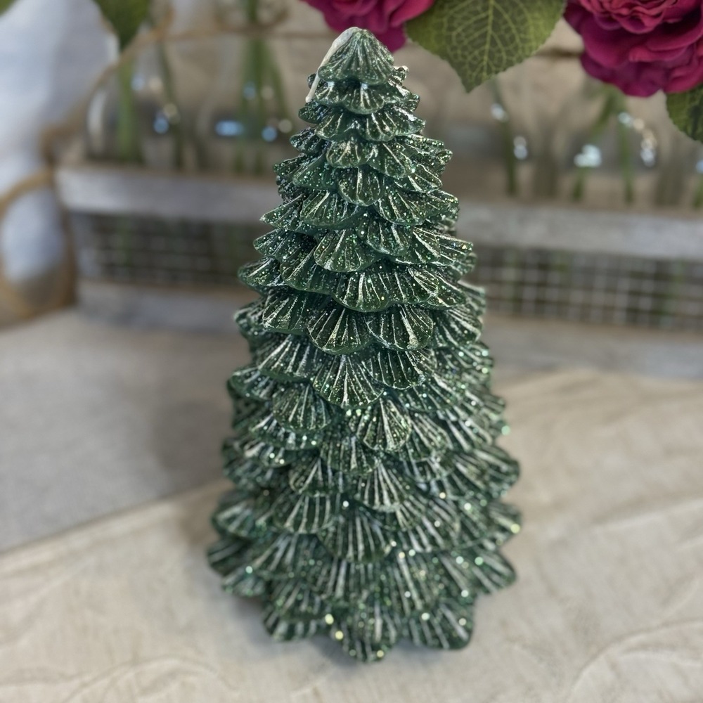 Christmas tree-shaped candle with a shimmery or snowy finish Illuminations‎